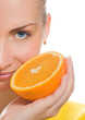 Beautiful girl with juicy orange