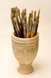 Pot filled with old paint brushes