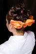 Latin model with curly styled hair.