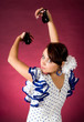Young Spanish flamenco performer playing the castanets Young Spanish flamenco performer playing the castanets