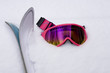 Photo: Hot Pink Ski Goggles and Skis in Snow Hot Pink Ski Goggles and Skis in Snow