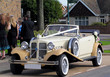 Vintage car waiting at the wedding with ribbons Vintage car waiting at the wedding with ribbons