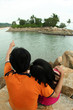 The Man pointing his finger to another island. .