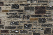 Old stone wall texture background with a bit of snow on it Old stone wall texture background with a bit of snow on it