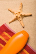 One sea star and a bottle of uv protection lotion One sea star and a bottle of uv protection lotion
