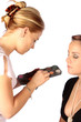 Makeup artist applying makeup for a formal function