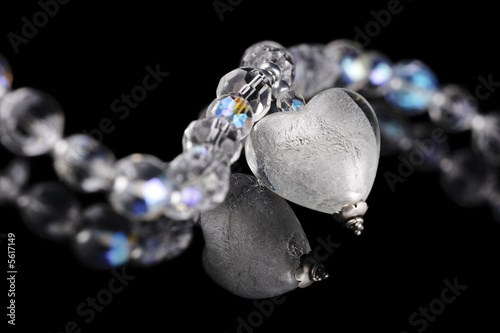 romantic beautiful loveheart crystal pendant on black background
