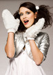 beautiful brunette winter girl wearing furry gloves 
