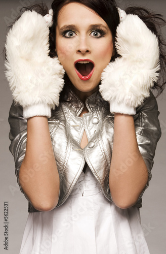 Photo: beautiful brunette winter girl wearing furry gloves beautiful brunette winter girl wearing furry gloves