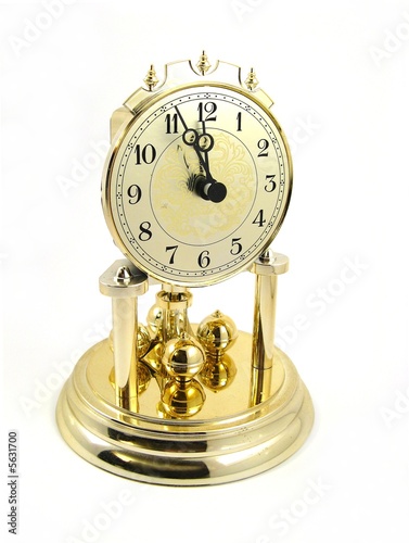 quartz clock showing five to twelfth