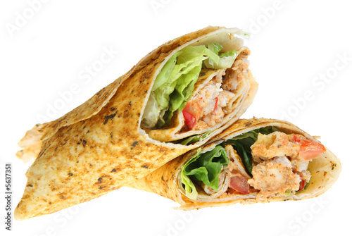 Spicy curried chicken pieces in a tortilla wrap
