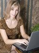 Pretty young woman working at the keyboard