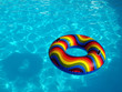 Swimming pool with a brightly coloured inflatable ring. Swimming pool with a brightly coloured inflatable ring.