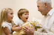 Children make a present to their grandpa   