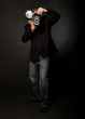 Retro style photographer with vintage camera and flash