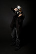Retro style photographer with vintage camera and flash