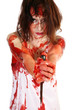 Woman covered in blood holding knife. Woman covered in blood holding knife.
