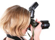 Young woman with camera isolated over white