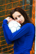 A beautiful soccer player holding a soccer ball