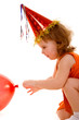 happy girl playing with colorful balloons