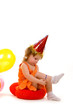 happy girl playing with colorful balloons