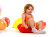 happy girl playing with colorful balloons