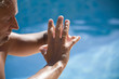 man meditating at the swimming pool side man meditating at the swimming pool side