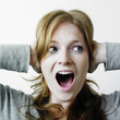 Woman covering ears