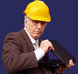 Checking the project on his laptop an engineer