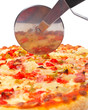 Italian pizza and cutter, on white background. Shallow DOF