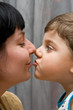 Mum and the son kiss