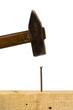 Hammer and nail, isolated on white background