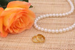 Orange Rose with Gold Wedding Rings and Pearls