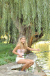 A beautiful young woman with a fishing pole A beautiful young woman with a fishing pole