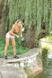 A beautiful young woman with a fishing pole A beautiful young woman with a fishing pole
