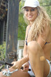 A beautiful young woman with a fishing pole A beautiful young woman with a fishing pole