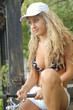 A beautiful young woman with a fishing pole A beautiful young woman with a fishing pole