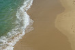 white wave in the sand at the beach