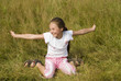 Girl plays on a meadow III