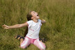 Girl plays on a meadow II