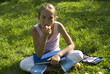 The girl draws on a meadow IV