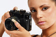 Sexy girl with slr photo camera taking a shoot. Sexy girl with slr photo camera taking a shoot.