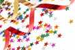 red and golden ribbons and small confetti stars, party time