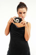 Sexy girl with old photo camera watching you. Sexy girl with old photo camera watching you.