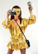 Sexy girl in golden mask & dress with old photo camera. Sexy girl in golden mask & dress with old photo camera.