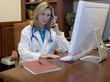 Female Doctor talking on phone in her office Female Doctor talking on phone in her office