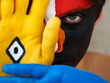 Foto: young man with a clown look, painted face, young man with a clown look, painted face,