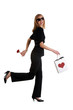 Elegant young woman walking with a rose in her hand
