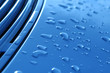 close-up of raindrops on metallic vehicle panel close-up of raindrops on metallic vehicle panel