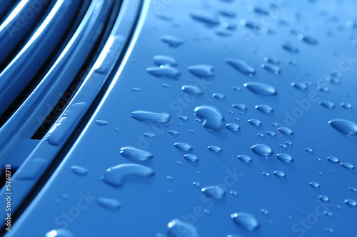 Photo: close-up of raindrops on metallic vehicle panel close-up of raindrops on metallic vehicle panel